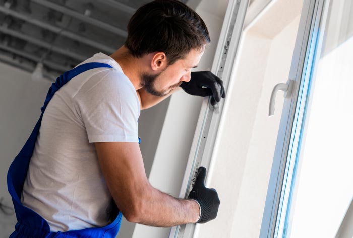 Man installing window